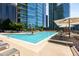 Resort-style rooftop pool featuring comfortable lounge chairs and umbrellas with amazing city views at 1080 Peachtree Ne St # 608, Atlanta, GA 30309