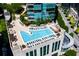Aerial view of the rooftop pool with lounge chairs, seating areas and trees with city view at 1080 Peachtree Ne St # 608, Atlanta, GA 30309
