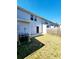 This backyard is enclosed with a wooden fence and has a concrete patio at 2533 Piering Dr, Lithonia, GA 30038
