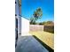 This backyard has a grassy area, a concrete patio, and a wooden fence at 2533 Piering Dr, Lithonia, GA 30038