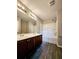 Bathroom featuring a double sink vanity and tub-shower combination with a shower caddy at 2533 Piering Dr, Lithonia, GA 30038
