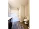 Full bathroom featuring a tub-shower combination with caddy, neutral colors, and toilet at 2533 Piering Dr, Lithonia, GA 30038