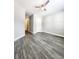 This bedroom features wood-look flooring and a ceiling fan with attached light fixture at 2533 Piering Dr, Lithonia, GA 30038