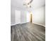 This bedroom includes wood-look flooring and a closet for storage at 2533 Piering Dr, Lithonia, GA 30038