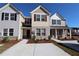 Charming townhome with brick accents, manicured landscaping, and inviting curb appeal at 2533 Piering Dr, Lithonia, GA 30038