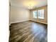 Spacious living room filled with natural light showcasing new floors at 2533 Piering Dr, Lithonia, GA 30038
