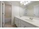 Bright bathroom featuring a double sink vanity and a tub/shower combo at 2687 Mountain Oaks Ct, Powder Springs, GA 30127