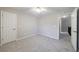 Neutral bedroom with carpeting and a view of the upstairs hallway at 2687 Mountain Oaks Ct, Powder Springs, GA 30127