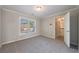 Bedroom with carpet and a view to the outside and door to the hallway at 2687 Mountain Oaks Ct, Powder Springs, GA 30127