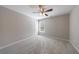 Bedroom with neutral walls, new carpet, ceiling fan, and a window at 2687 Mountain Oaks Ct, Powder Springs, GA 30127