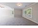 Spacious bedroom with ample natural light and neutral carpet at 2687 Mountain Oaks Ct, Powder Springs, GA 30127