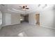 A very large carpeted bedroom with many windows and multiple entry doors at 2687 Mountain Oaks Ct, Powder Springs, GA 30127