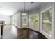 Bright breakfast nook with natural light, hardwood floors and view of the fireplace at 2687 Mountain Oaks Ct, Powder Springs, GA 30127