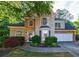 Charming two-story home with stone accents, manicured landscaping, and a welcoming front entrance at 2687 Mountain Oaks Ct, Powder Springs, GA 30127
