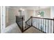 Upstairs hallway with chandelier and carpet flooring at 2687 Mountain Oaks Ct, Powder Springs, GA 30127