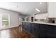 Modern kitchen with a large island, white cabinets, granite countertops, and stainless steel appliances at 2687 Mountain Oaks Ct, Powder Springs, GA 30127