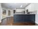 Modern kitchen with stainless appliances, hardwood floors, and gray cabinets at 2687 Mountain Oaks Ct, Powder Springs, GA 30127