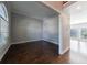 Bright living room featuring high ceilings, hardwood floors, and a large arched window at 2687 Mountain Oaks Ct, Powder Springs, GA 30127