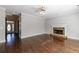 Inviting living room with stone fireplace, hardwood floors, and front door access at 2687 Mountain Oaks Ct, Powder Springs, GA 30127