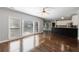 Open living room features hardwood floors, fireplace, windows and opens to kitchen at 2687 Mountain Oaks Ct, Powder Springs, GA 30127