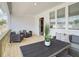Relaxing back porch with comfortable seating, a wooden deck, and view of the nearby lake at 4814 Floydwood Ln, Mableton, GA 30126