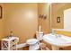 Bathroom featuring a toilet, sink, and small vanity at 725 Windsor Place Sw Cir, Grayson, GA 30017