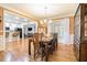 Inviting dining area with hardwood floors and view into the kitchen, perfect for entertaining at 725 Windsor Place Sw Cir, Grayson, GA 30017