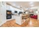 Bright kitchen with stainless steel appliances, granite countertops, and a breakfast bar with stylish pendant lighting at 725 Windsor Place Sw Cir, Grayson, GA 30017