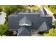 Aerial view showcasing the roofline, landscaping, and patio of this luxury home at 328 Broadmoor Way, Mcdonough, GA 30253