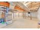 An unfinished basement with exposed beams and a concrete floor, ready for customization at 328 Broadmoor Way, Mcdonough, GA 30253