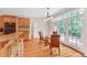 Charming breakfast nook featuring hardwood floors, a glass table, and French doors at 328 Broadmoor Way, Mcdonough, GA 30253