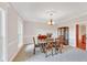Formal dining room featuring chair rail and decorative lighting at 328 Broadmoor Way, Mcdonough, GA 30253