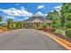 Beautiful entrance with neatly trimmed bushes on a sunny day leading into a private community at 328 Broadmoor Way, Mcdonough, GA 30253