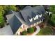 Aerial view of stunning home with a well manicured yard and mature shade trees at 328 Broadmoor Way, Mcdonough, GA 30253