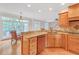 Kitchen showcasing granite countertops, stainless appliances, and wood floors at 328 Broadmoor Way, Mcdonough, GA 30253