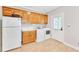 Functional laundry room with ample cabinetry, a sink, and white appliances at 328 Broadmoor Way, Mcdonough, GA 30253