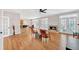 Inviting living room with fireplace, hardwood floors, and adjacent kitchen at 328 Broadmoor Way, Mcdonough, GA 30253