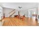 Spacious living room with hardwood floors and staircase bathed in natural light at 328 Broadmoor Way, Mcdonough, GA 30253