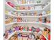 Walk-in pantry with plenty of storage space on shelves for food and kitchen supplies at 328 Broadmoor Way, Mcdonough, GA 30253