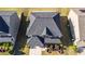 Aerial view of a well-maintained house featuring a landscaped front yard and a pristine roof at 4750 Sabino Bnd, Cumming, GA 30040