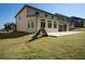View of the backyard with an extended patio connected to the home at 4750 Sabino Bnd, Cumming, GA 30040