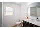 Cozy bathroom featuring a vanity with marble countertop and a framed mirror at 4750 Sabino Bnd, Cumming, GA 30040