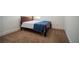 Cozy bedroom with neutral carpet, a queen bed with blue accents, and natural light at 4750 Sabino Bnd, Cumming, GA 30040