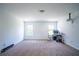 Spacious bonus room featuring carpet, windows for natural light, and fixtures for media entertainment at 4750 Sabino Bnd, Cumming, GA 30040