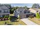 Beautiful two-story home with a two-car garage, lush landscaping, and a well-maintained lawn at 4750 Sabino Bnd, Cumming, GA 30040