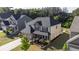 Gorgeous home with a manicured lawn, stone accents, and a neatly landscaped front yard at 4750 Sabino Bnd, Cumming, GA 30040