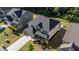 Well-kept home with manicured lawn, stone accents, and long driveway leading to the attached garage at 4750 Sabino Bnd, Cumming, GA 30040