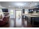 Open-concept home with an island kitchen, fireplace and hardwood floors at 4750 Sabino Bnd, Cumming, GA 30040
