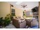 Covered patio with outdoor furniture, ceiling fan, and a fireplace for relaxing at 4750 Sabino Bnd, Cumming, GA 30040