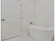 Elegant bathroom features a modern standalone tub with sleek fixtures at 60 Wheeler Lake Path, Dallas, GA 30157